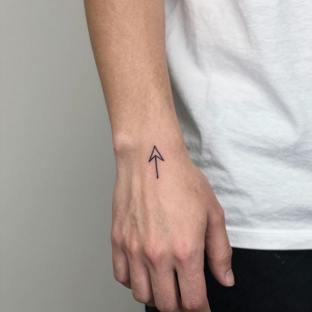 Mens hand tattoo ideas - Minimalist Arrow on the Side